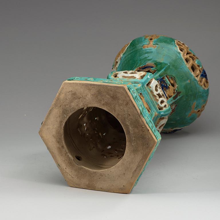 A green glazed Shiwan-ware stool, Qing dynasty, 19th Century.