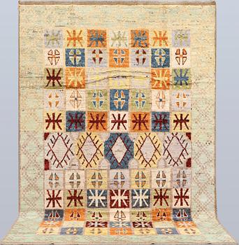 A Moroccan design carpet, c. 299 x 198 cm.