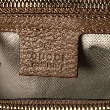 A bag "Bamboo shopper" by GUCCI.