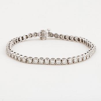 TENNIS BRACELET, 14K white gold with 49 diamonds approx. 5.06 cts.