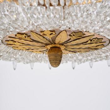 An ormolu and cut glass sixteen-branch Empire chandelier, Paris, early 19th century.