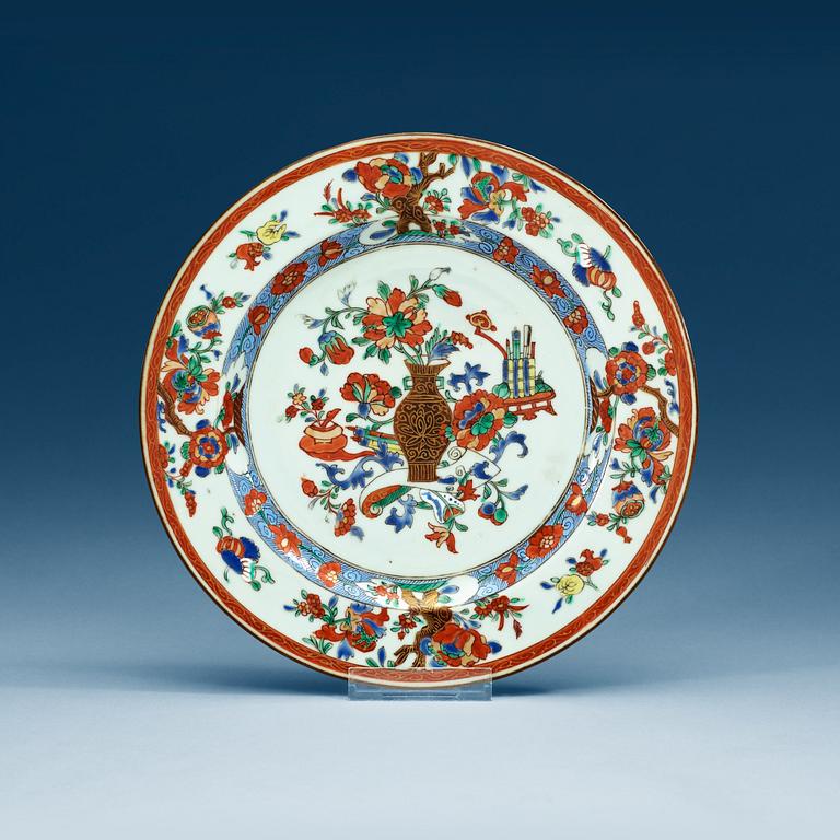 A set of 12 famille rose dinner plates, Qing dynasty, Qianlong (1736-95).