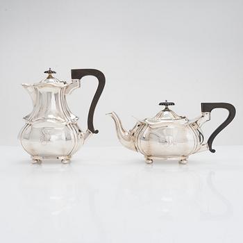 A four-piece sterling silver tea and coffee set, maker's mark of Joseph Gloster Ltd, Birmingham 1911, 1919 and 1922.