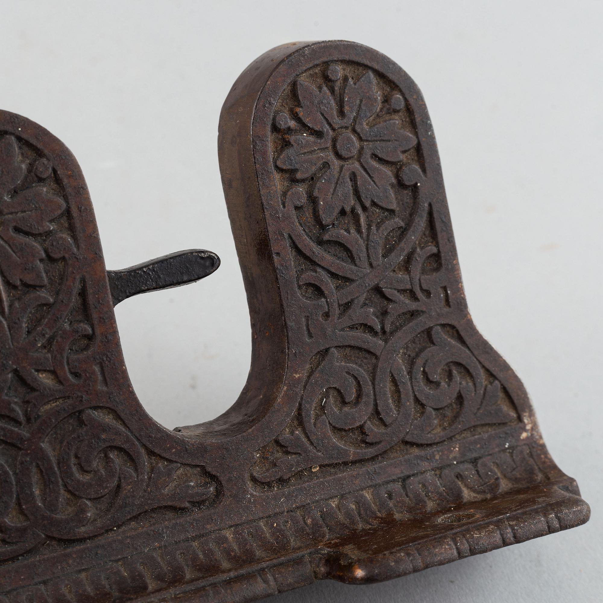 A 19th century iron umbrella and walkingstick holder.