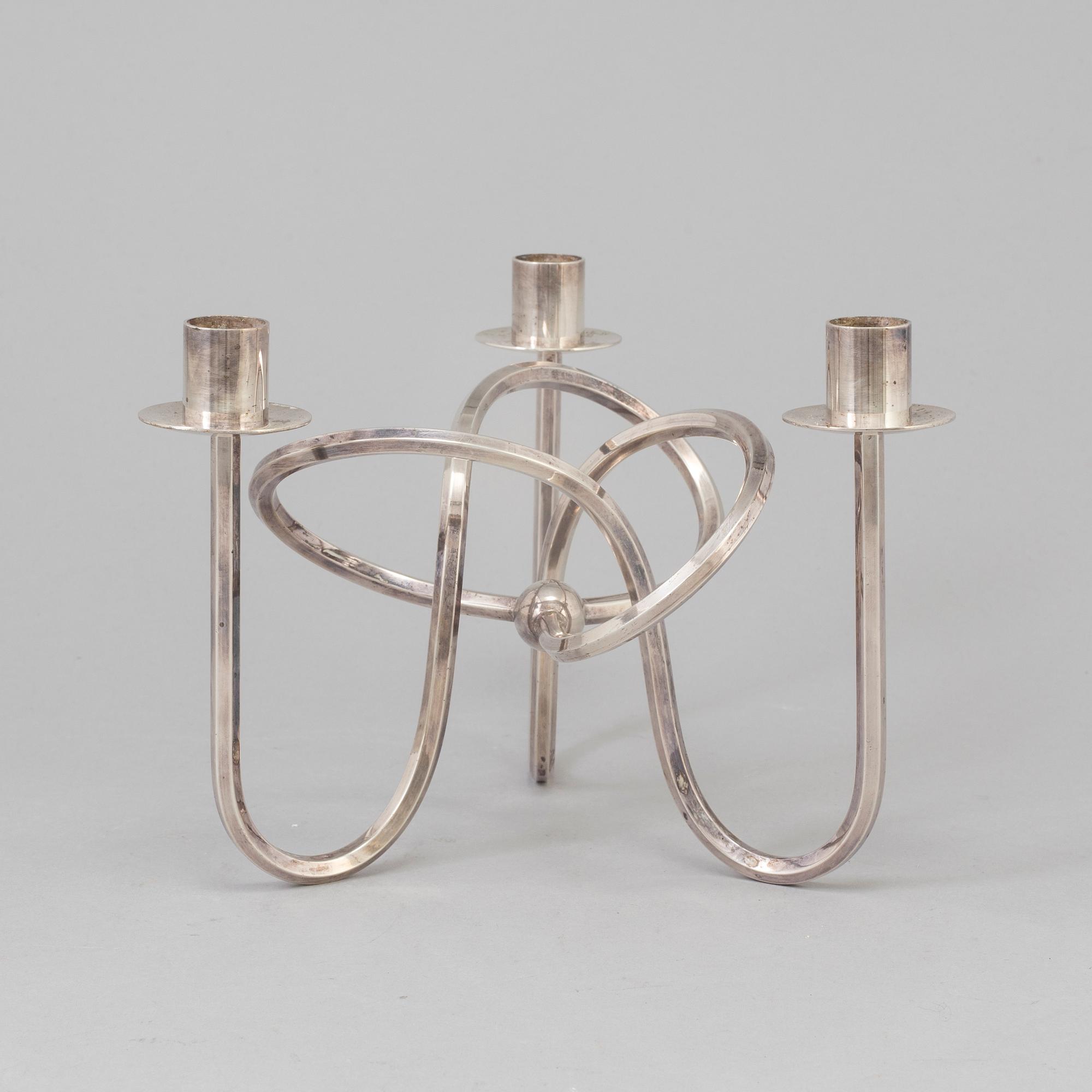 Josef Frank, a silver platen "Vänskapsknuten" candelabra ju Josef Frank för Firma Svenskt Tenn.