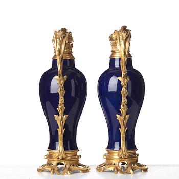 A pair of gilt bronze mounted vases, Qing dynasty, Qianlong (1736-95). French bronze mounts.