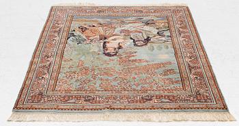 An oriental figural rug, c. 182 x 128 cm.