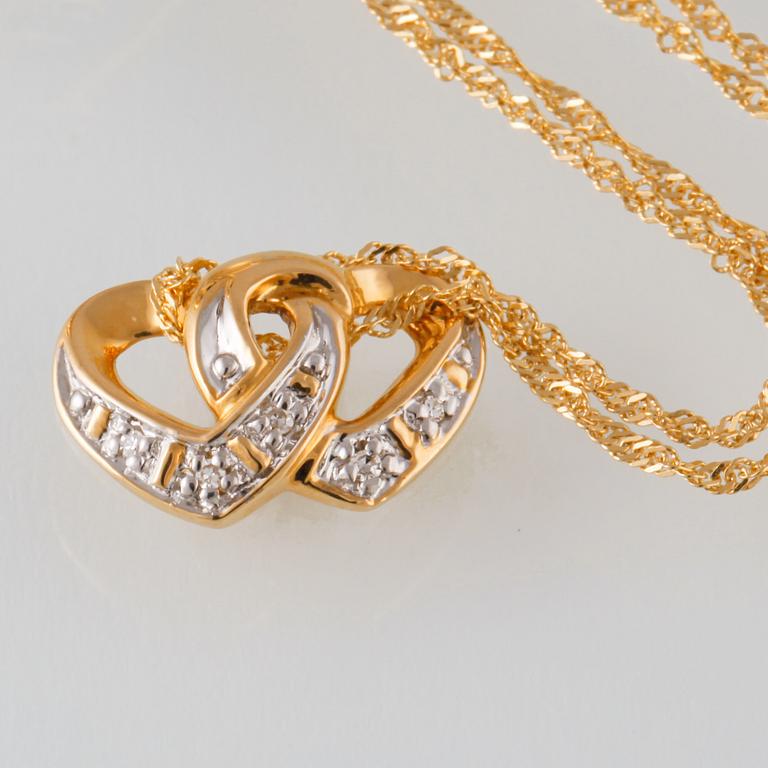 HÄNGE SAMT RING, 18K guld med 10 åttkantslipade diamanter. Vikt 3,5 gram.