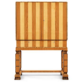 282. GUSTAV BERGSTRÖM, attributed to, a Swedish Grace cabinet on stand, 1930's.