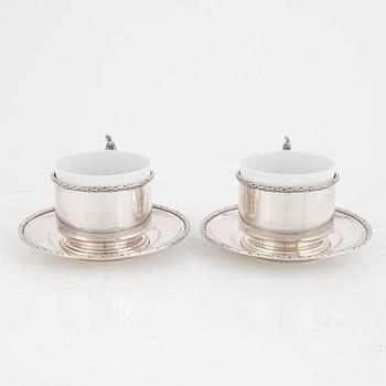 Silver tea mug holders with saucers, Pest, Austria, around 1900.