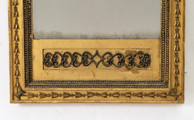an Empire mirror, Sweden, early 19th century.