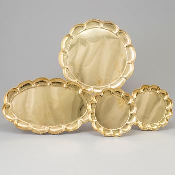 A set of four brass plates by Ture Henrikson, Arvika.