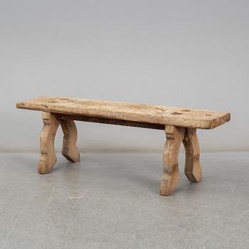 A 19th century folk art bench.