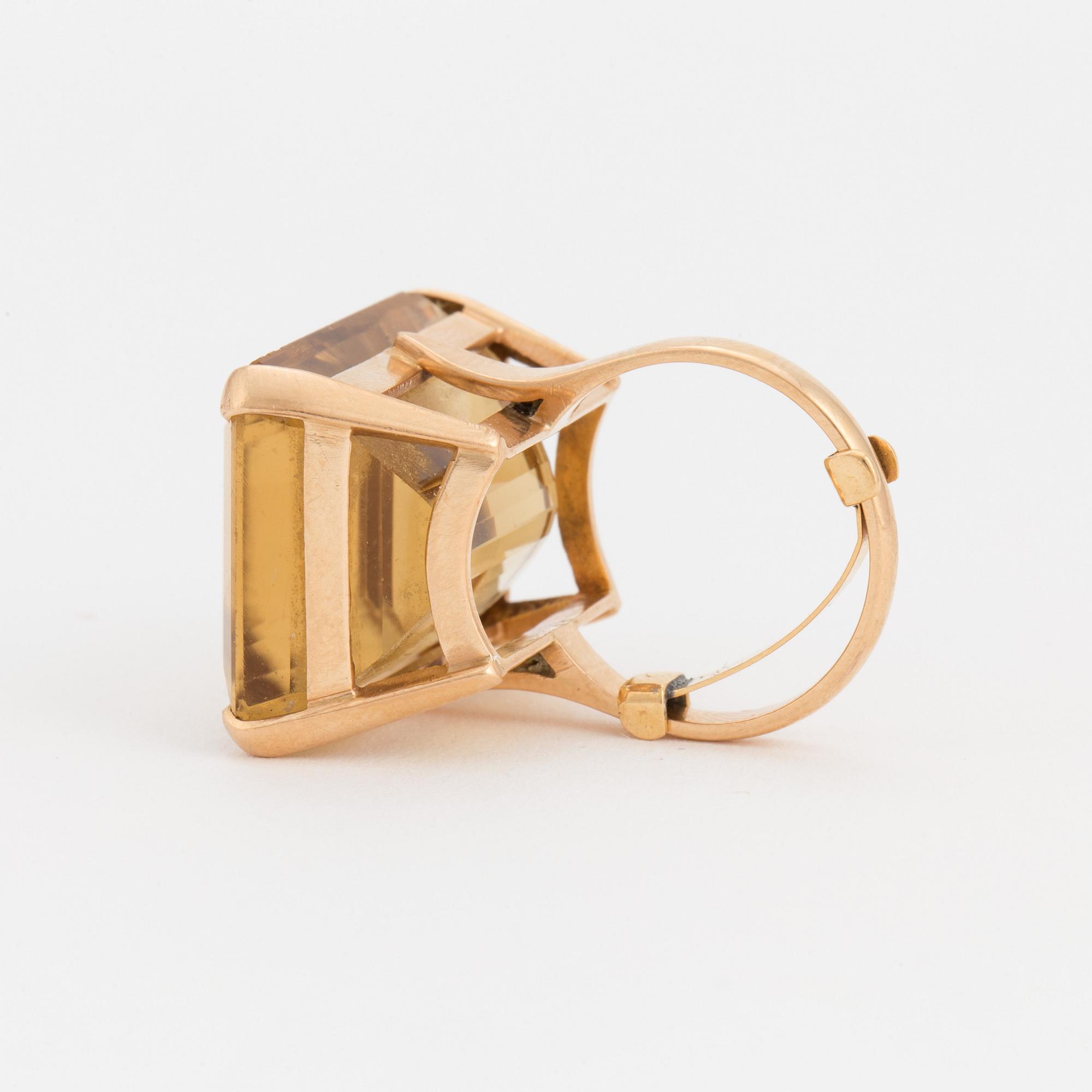 A ring set with a step-cut citrine.