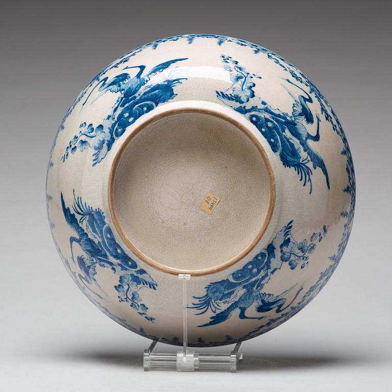 A large blue and white armorial punch bowl with cover, Qing dynasty, Qianlong (1736-95).