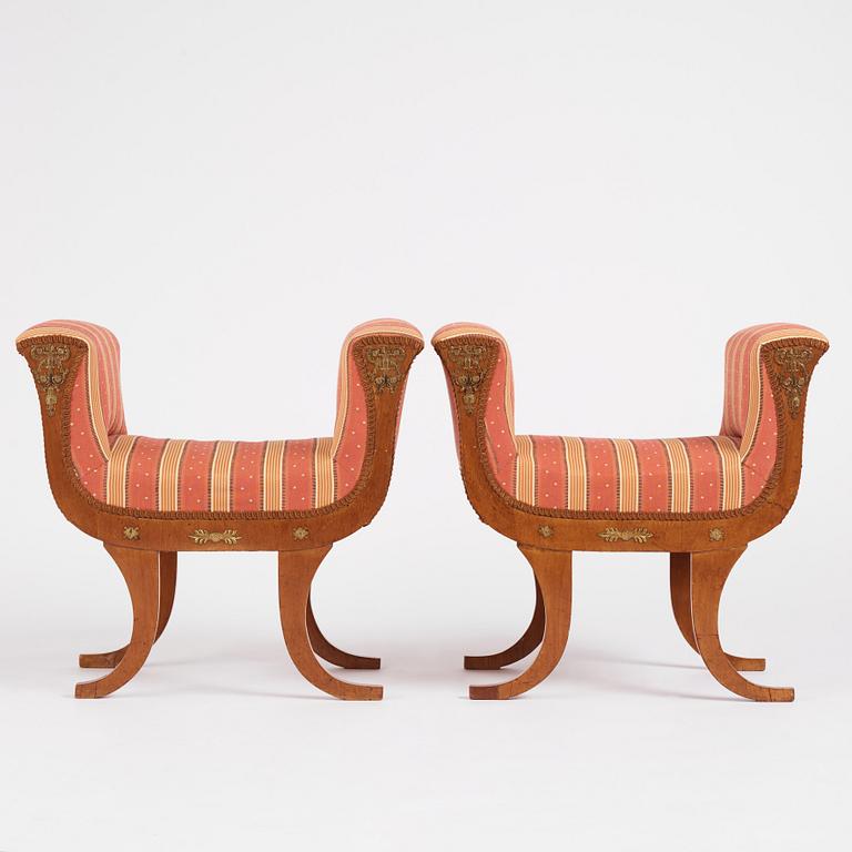 A pair of Swedish Royal Empire stools.