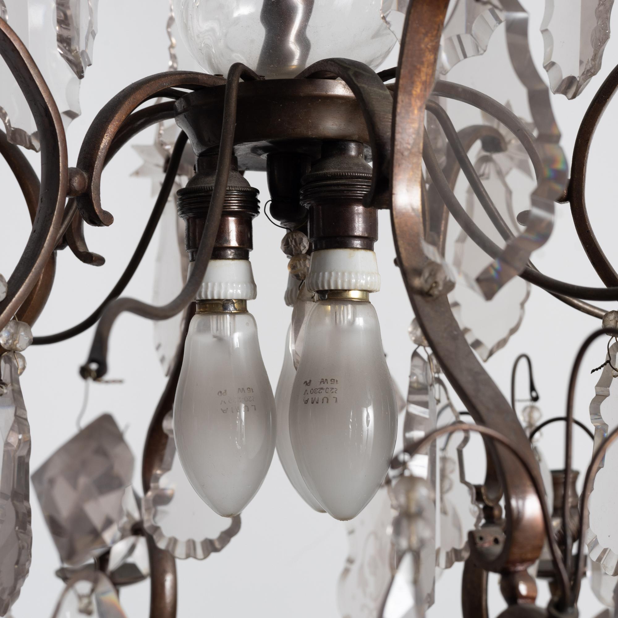 A Rococo style chandelier, early 20th century.