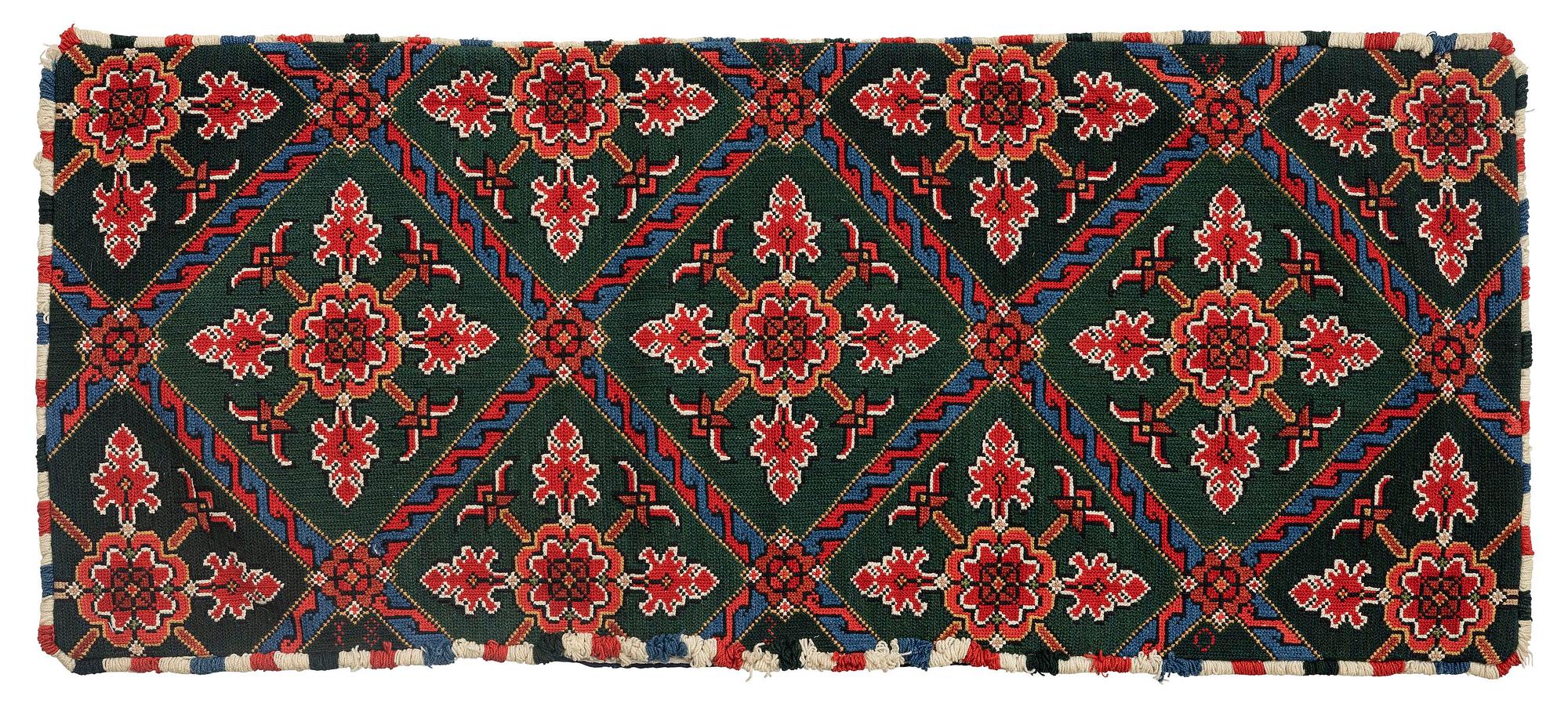 A carrige cushion, embroidered, 122 x 52 cm, Scania, dated 1830.