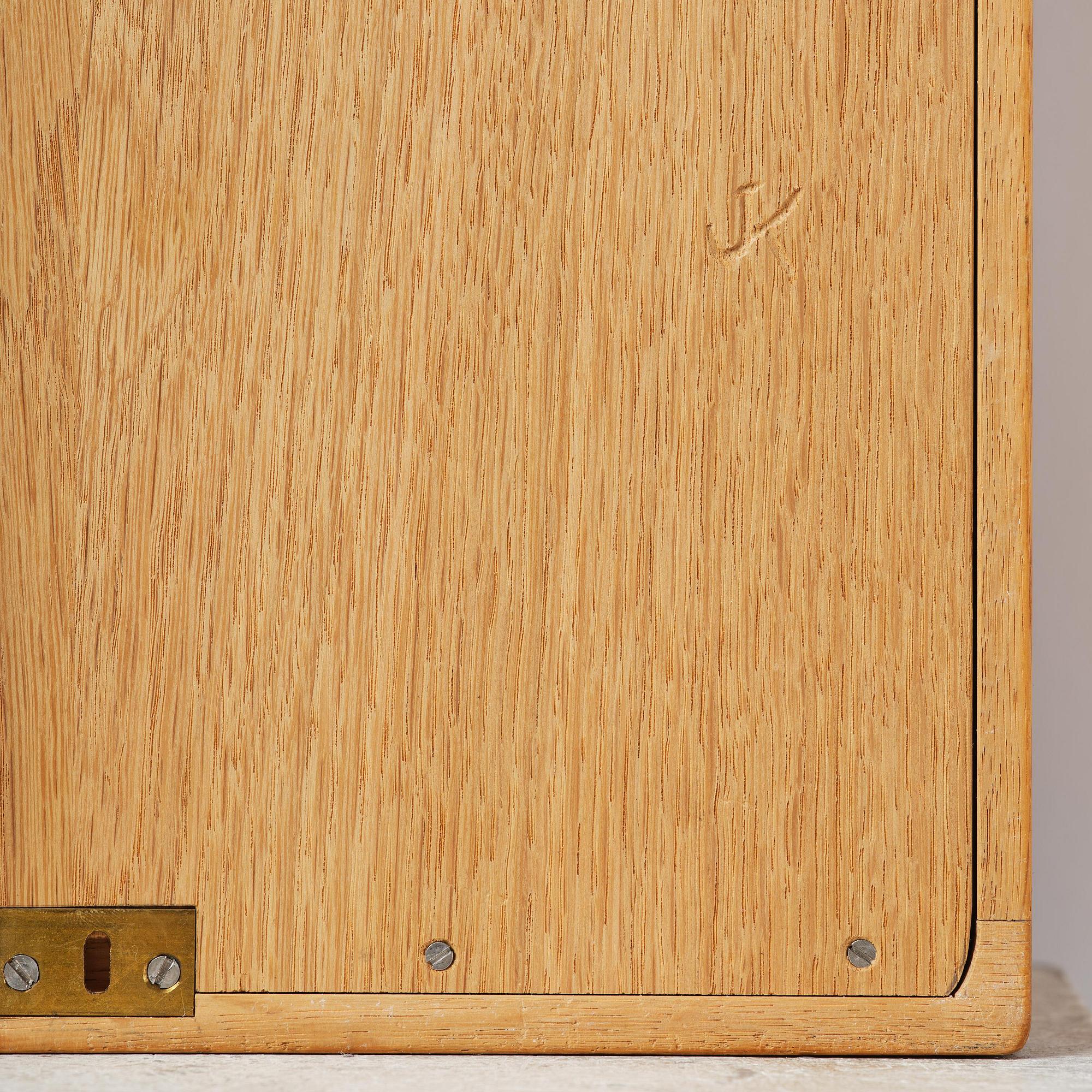 James Krenov, an oak or doussie showcase wall cabinet, executed in his own workshop, Bromma, Sweden.