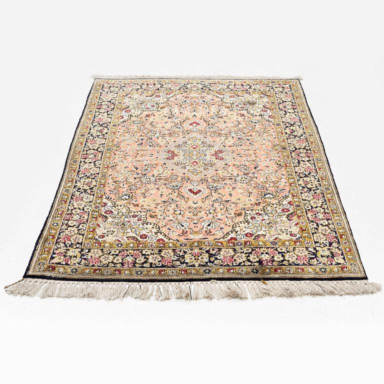 A Ghom silk rug, c. 158 x 105 cm.