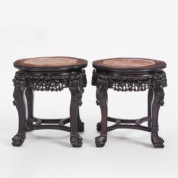 A pair of Chinese hardwood marble top tables, circa 1900.