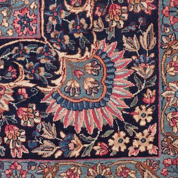 A CARPET, a semi-antique Kerman, ca 601 x 387 cm.