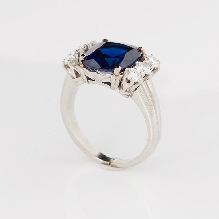 A RING set with a faceted sapphire.