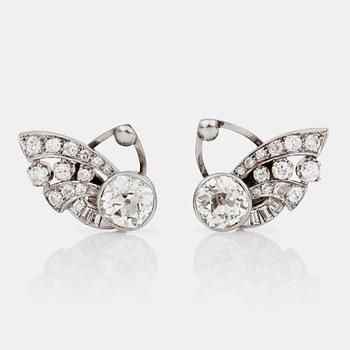 A pair of old-cut diamond earrings. Total carat weight of diamonds circa 5.00 cts. The large diamonds circa 2 cts each.