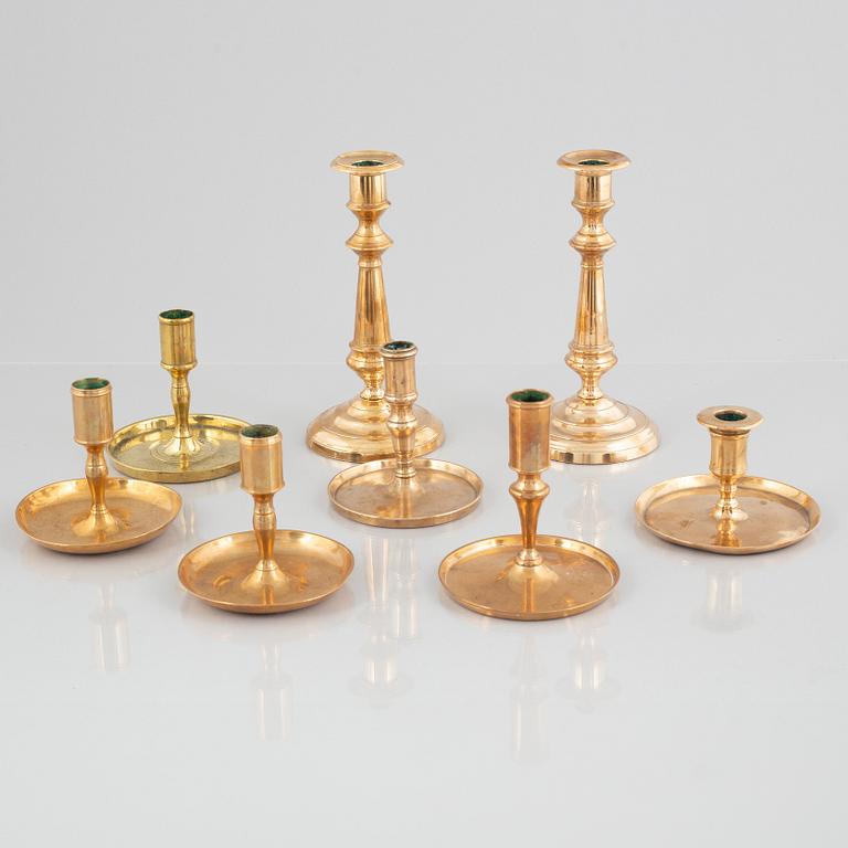 Eight brass candlesticks, including Skultuna Bruk, 19th century.