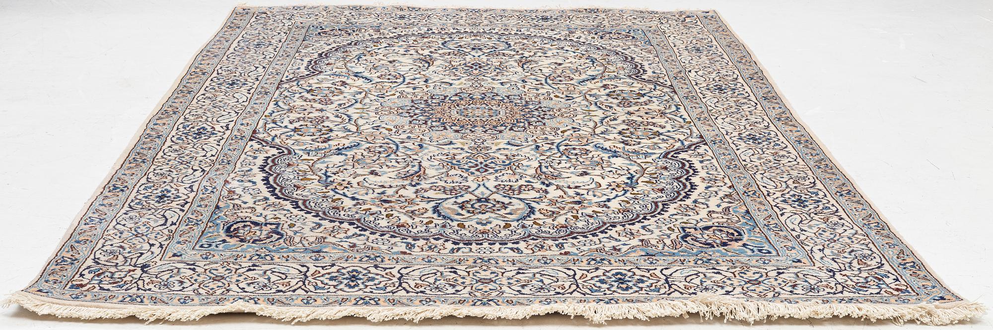 A Nain carpet, c. 310 x 195 cm.