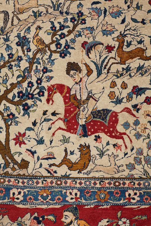 A CARPET, a semi-antique Teheran probably, a figural part silk, ca 347,5-345,5 x 242 cm.