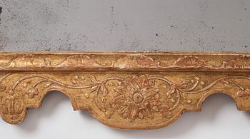 A Northern-European late Baroque two-light giltwood mirror sconce, first part of the 18th century.