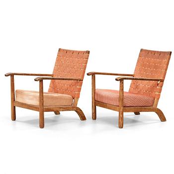 145. Axel Einar Hjorth, a pair of pine easy chairs, probably model 'Väddö' by Nordiska Kompaniet, Sweden 1930's.