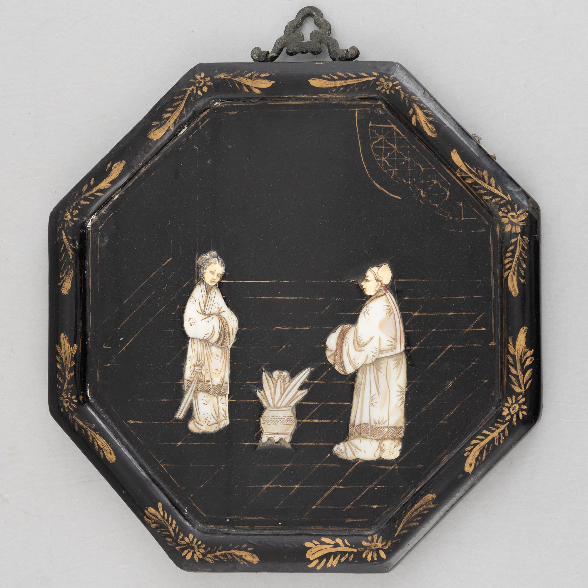 Four black-lacquered wall decorations, China, around 1900.
