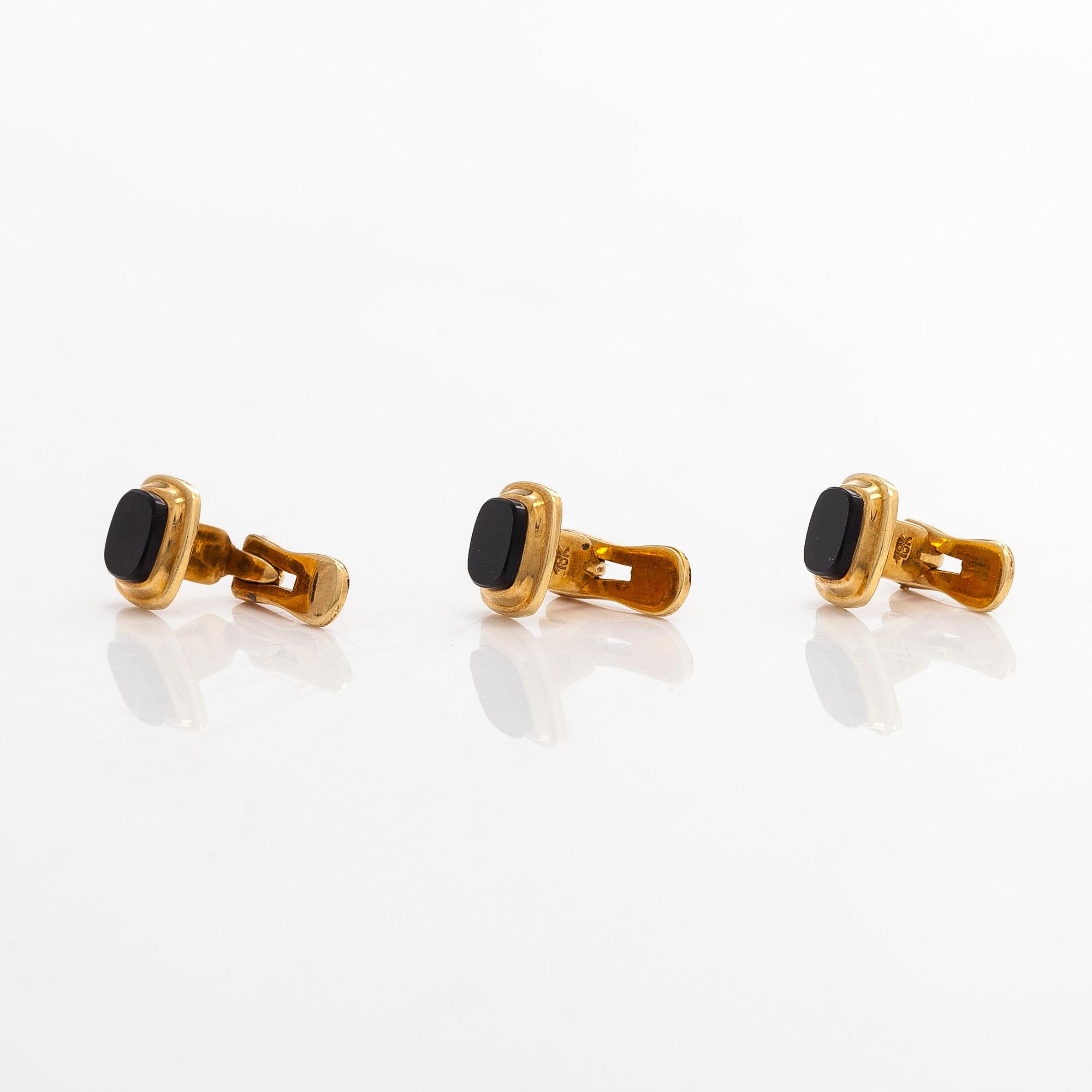 A pair of cufflinks and three shirt buttons,  18K gold and onyx.