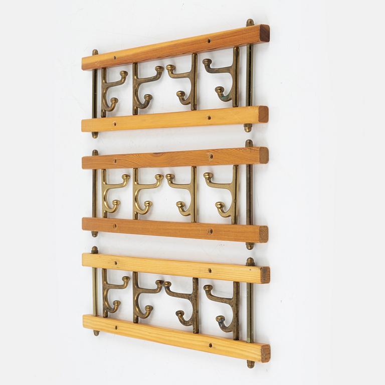 A group of three 'Dekorativ' coat hangers, Skoglunds metallgjuteri, Anderstorp, 1950's/60's.