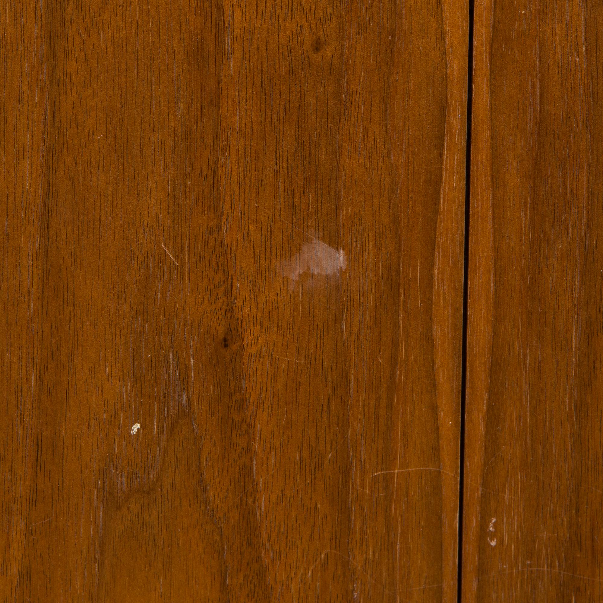 A 1960s teak and oak dining table.