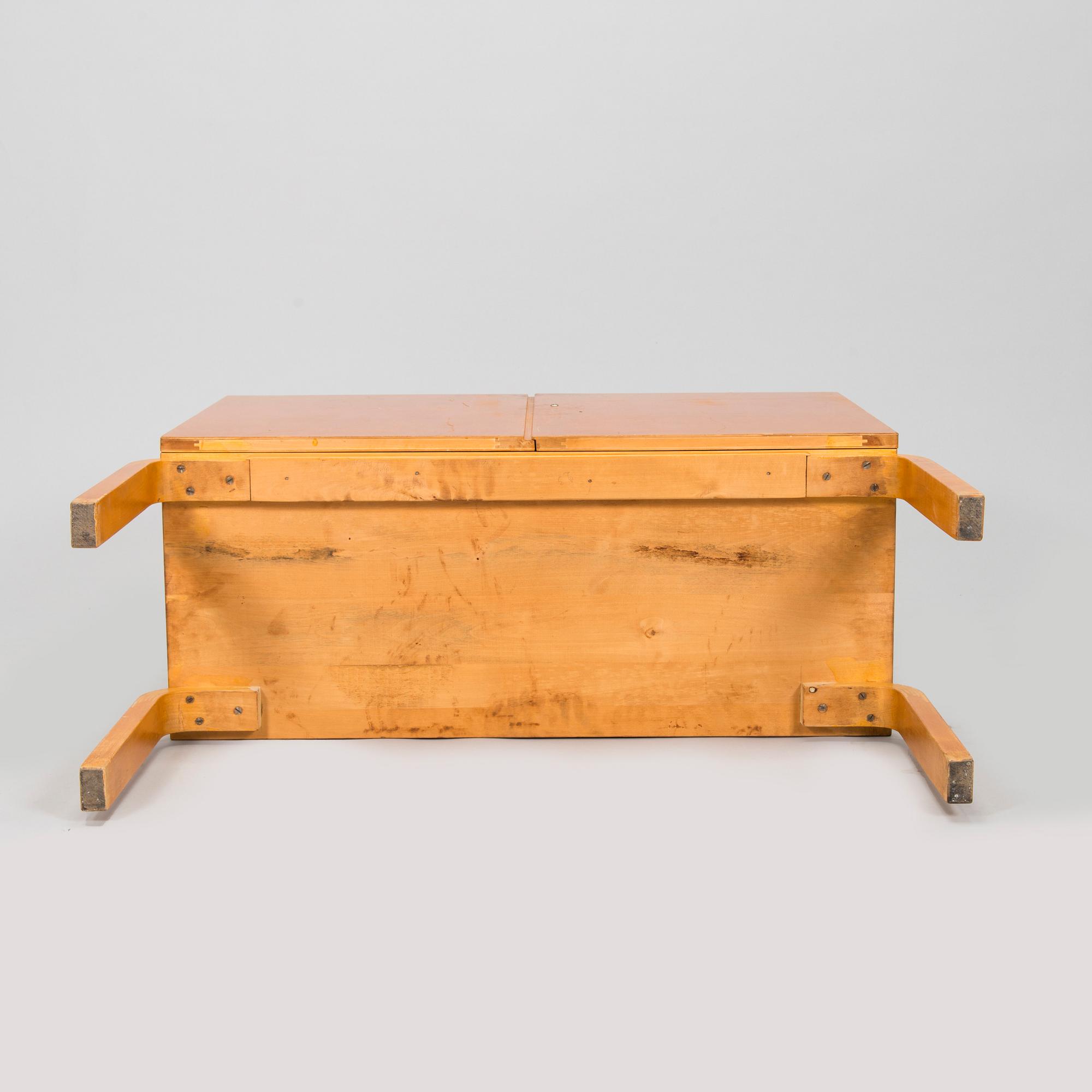 Alvar Aalto, mid-20th century '810' cabinet and a 
'69'chair Oy Huonekalu- ja Rakennustyötehdas Ab.