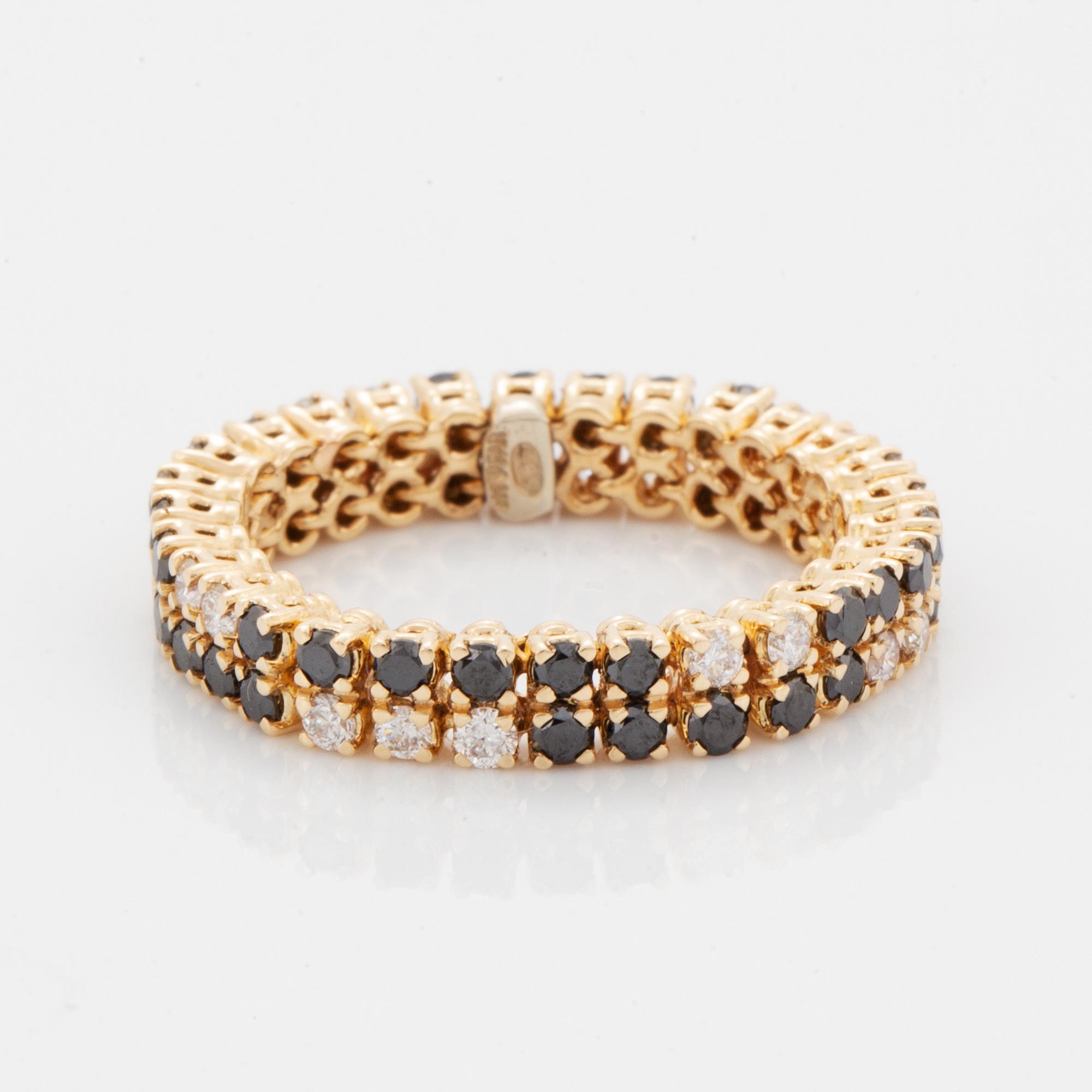 White and black brilliant-cut diamond ring.