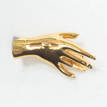 Estrid Ericson, a brooch.