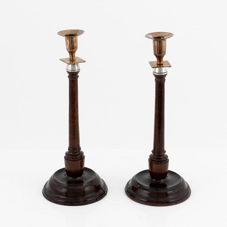 A pair of 19th century candlesticks in wood and brass and white metal.