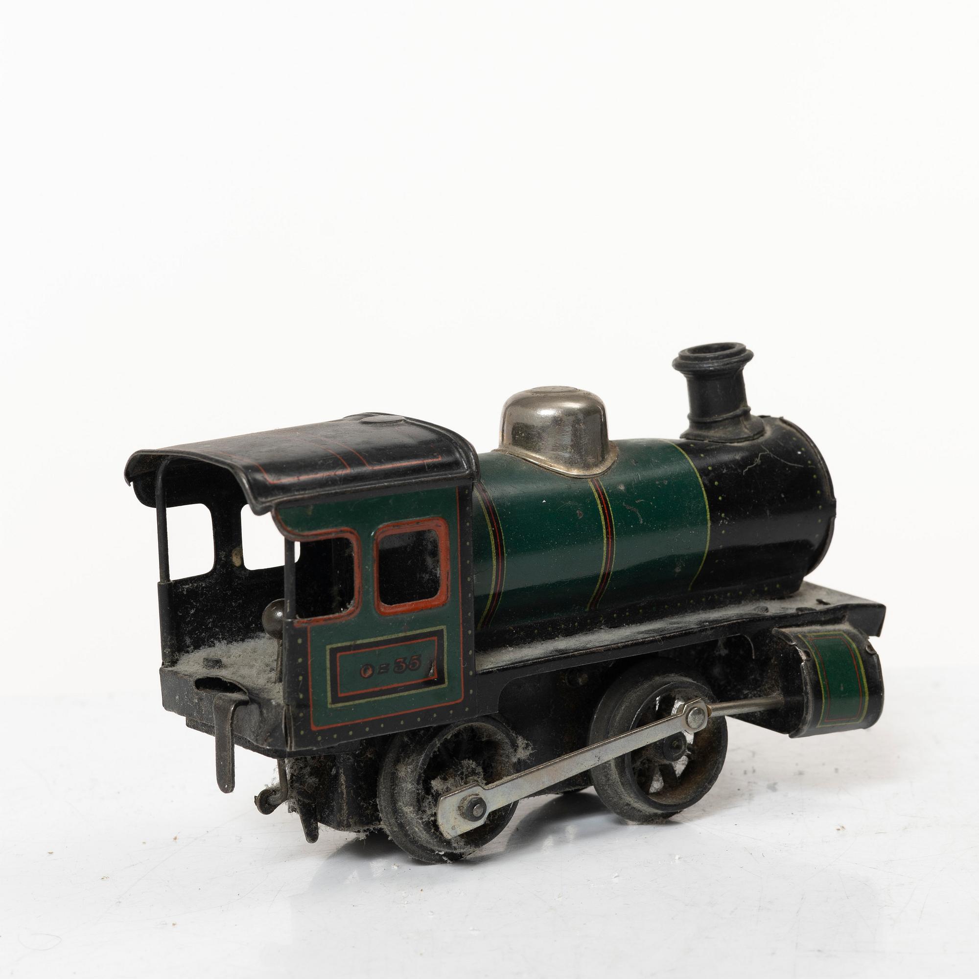 Model train with track and station building, 13 pieces, Germany, 1920s.