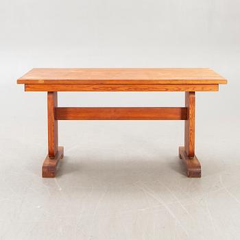A 1940s pine dining table.