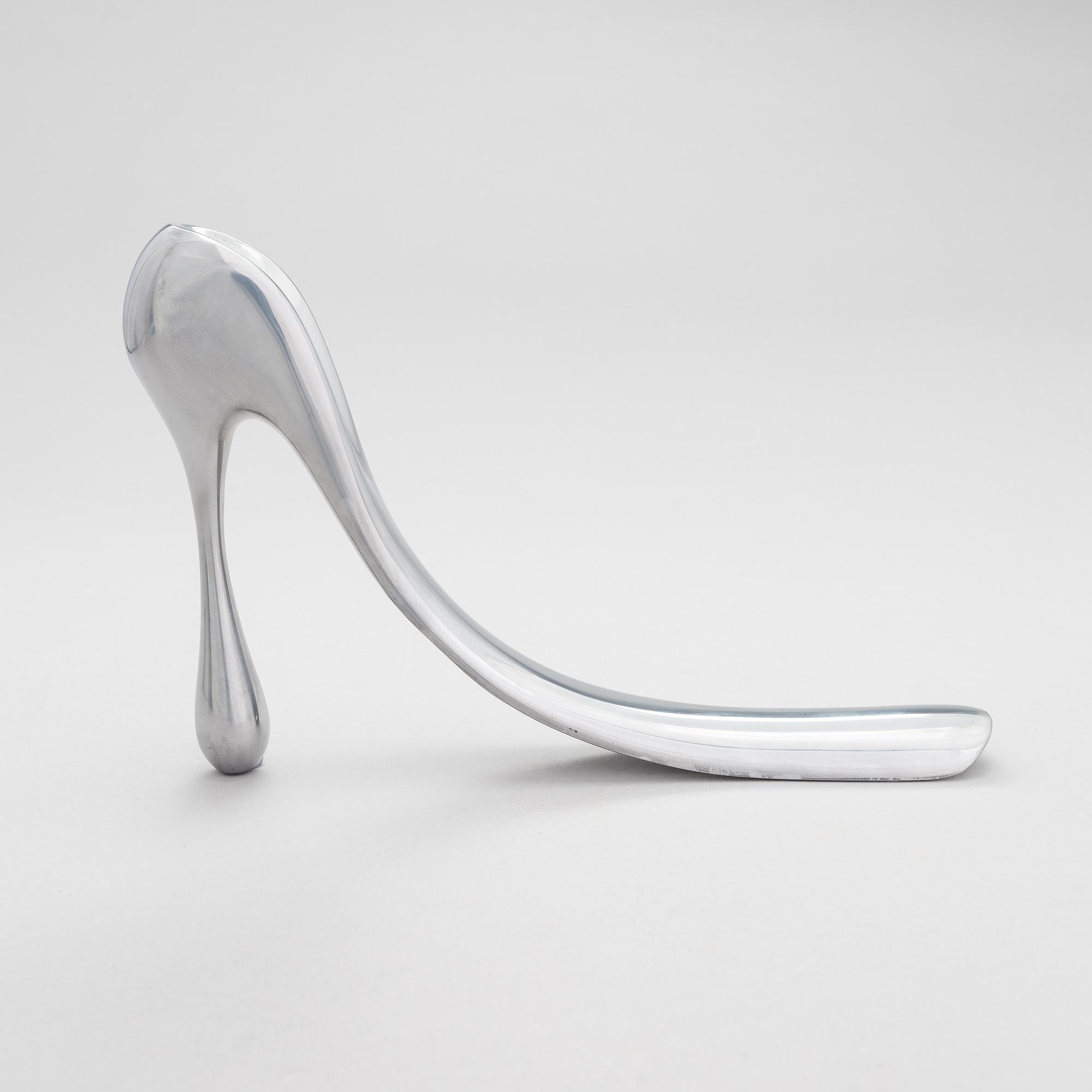 A metal shoe horn by Manolo Blahnik, 2000s.