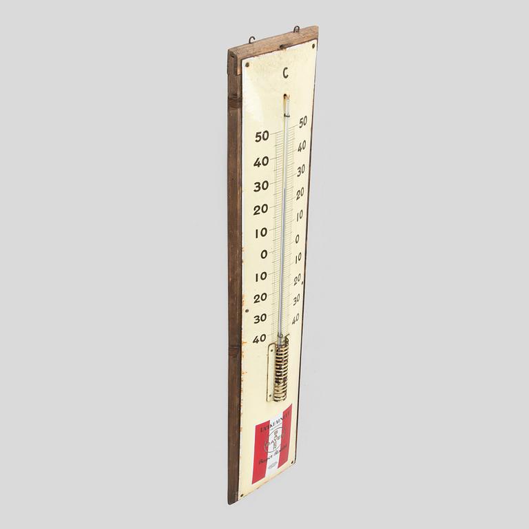 a mid-20th century outdoor thermometer.