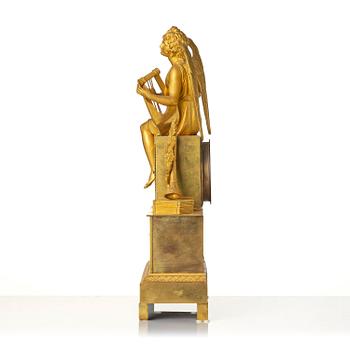 A figural Empire ormolu mantel clock, Paris, early 19th century.
