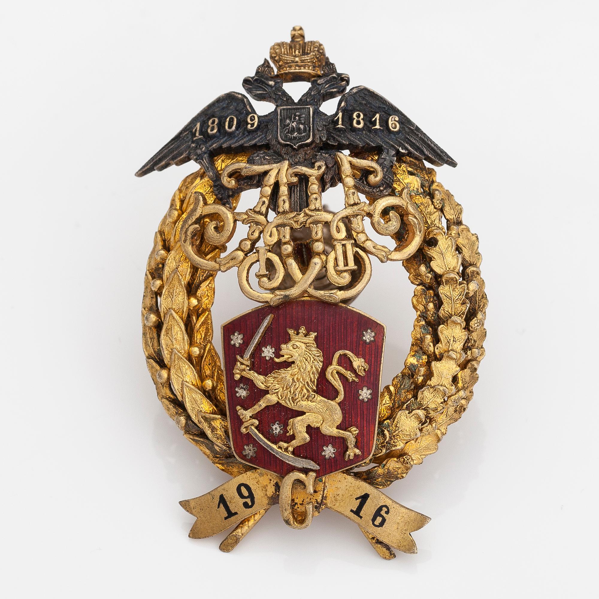 KUNNIAMERKKI, kullattua hopeaa ja emalia. Finska guldsmeds AB, Suomi/Venäjä 1916.