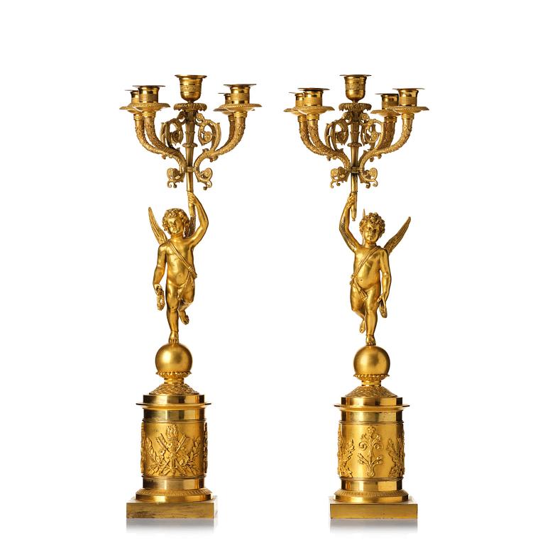 A pair of Empire five lights candelabra.