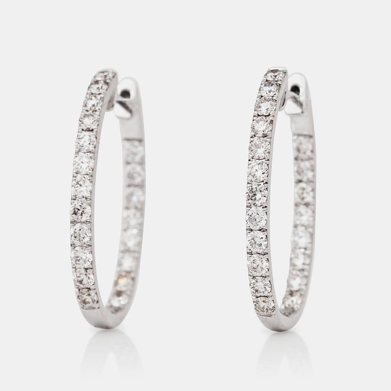 A pair of ovale diamond, 1.38 cts according to engraving, loop earrings.
