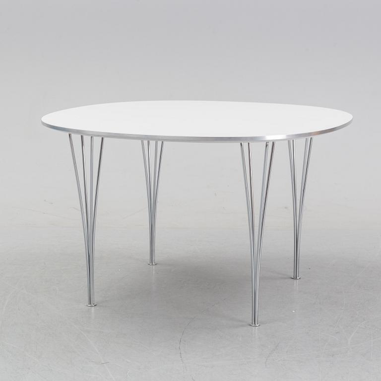 A 'Supercircular' table by Bruno Mathsson & Piet Hein for Fritz Hansen, dated 1985.